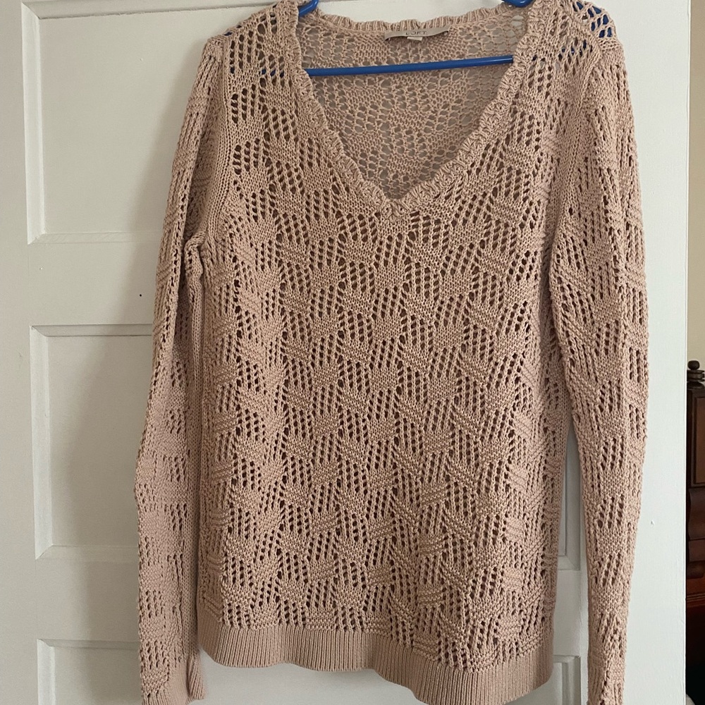Open knit sweater.  New without tags.  Runs small as in size 12